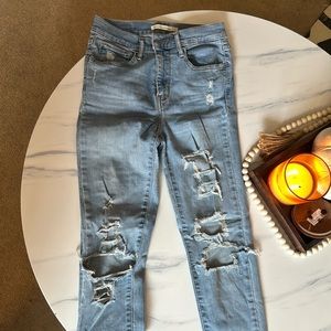 Levi Strauss High Rise Super Skinny ripped jeans